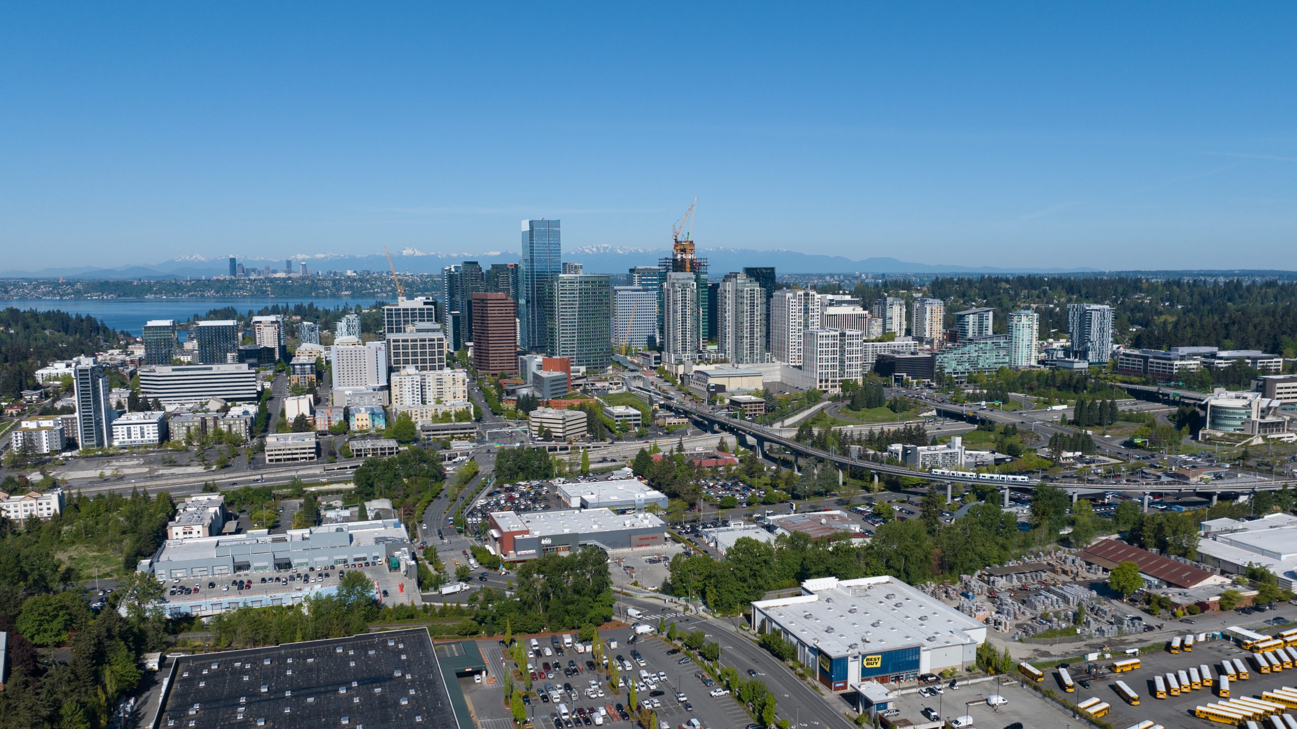 Aerial view of the downtown Bellevue skyline and surrounding greenery.