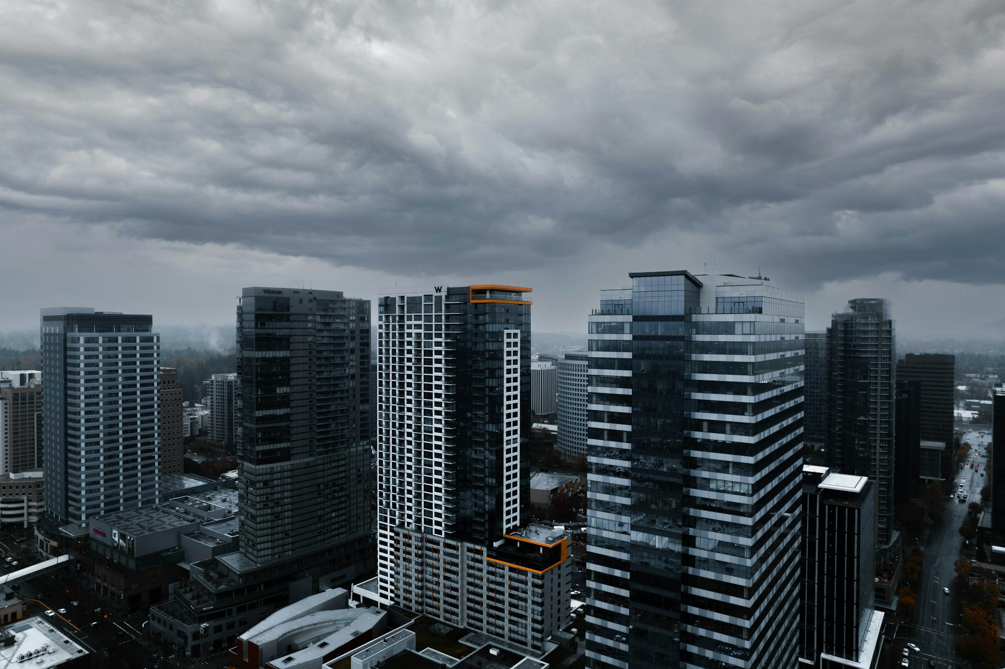 An elevated view of downtown Bellevue buildings beneath an overcast sky.