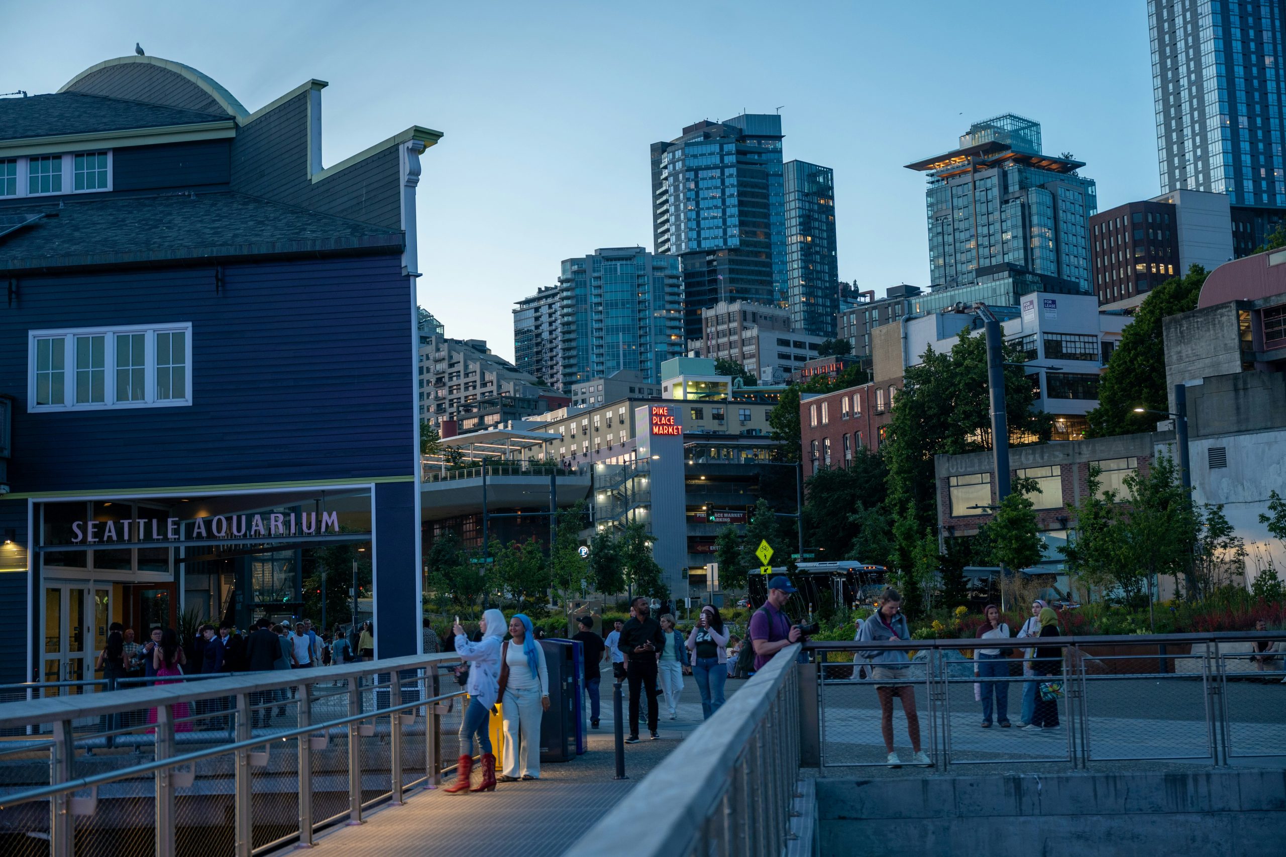 Seattle waterfront walkway beside the Aquarium with downtown buildings beyond